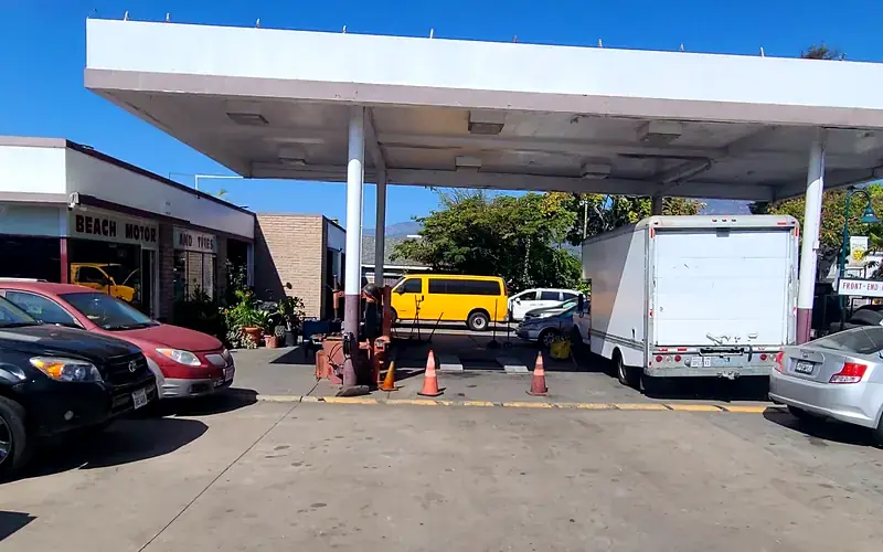The covered yard at Beach Motor & Tires with vehicles waiting for service